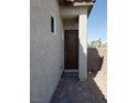 Side entrance with a walkway and brick pavers at 1706 Pondering Ave, North Las Vegas, NV 89031