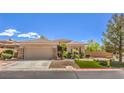 Single story home with attached garage and landscaped lawn at 3 Chatmoss Rd, Henderson, NV 89052