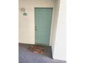 Light teal colored front door with a welcome mat at 3550 Bay Sands Dr # 2048, Laughlin, NV 89029