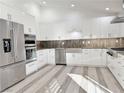 Modern kitchen with stainless steel appliances and white cabinetry at 3760 Yorba Linda Dr, Las Vegas, NV 89122