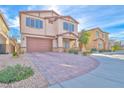 Two-story house with brown garage door and landscaped yard at 4025 Redwood Glen Ct, Las Vegas, NV 89141