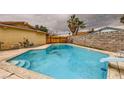 A refreshing in-ground pool with a diving board, steps, and surrounding patio space at 4214 Bay Cir, Las Vegas, NV 89122