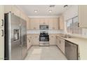 Modern kitchen with stainless steel appliances, ample counter space, and stylish cabinetry at 4929 Morning Falls Ave, Las Vegas, NV 89131