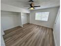 Bright bedroom with double closets and wood-look flooring at 501 S Maryland Pkwy # B2, Las Vegas, NV 89101