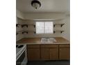 Simple kitchen, offering ample counter space and wooden cabinets at 521 S Maryland Pkwy # A10, Las Vegas, NV 89101