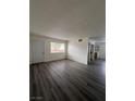 Open living room with gray flooring and access to entryway at 521 S Maryland Pkwy # A10, Las Vegas, NV 89101