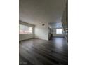 Spacious living room featuring gray vinyl flooring and open floor plan at 521 S Maryland Pkwy # A10, Las Vegas, NV 89101