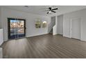 Spacious living room with hardwood floors and sliding glass doors at 5960 Palmilla St # 3, North Las Vegas, NV 89031