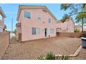 A spacious backyard with low maintenance landscaping and a view of neighboring homes at 9247 Tulip Trestle Ave, Las Vegas, NV 89148