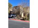 Two-story house with driveway and mature tree at , North Las Vegas, NV 89081