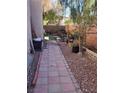 Landscaped side yard with pathway and storage at , North Las Vegas, NV 89081