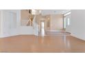 Spacious entryway with hardwood and tile floors and a staircase at 31 Castle Creek Ct, Las Vegas, NV 89148