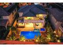 Night view of house, pool, and backyard at 351 Elder View Dr, Las Vegas, NV 89138