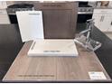Display of kitchen finishes, including cabinetry and flooring options at 4748 Parkarbor Ave, Las Vegas, NV 89141
