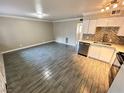 Modern kitchen with white cabinets and gray tile floors at 501 S Maryland Pkwy # B14, Las Vegas, NV 89101