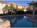 Inviting backyard pool and spa with a covered patio at 502 Pale Pueblo Ct, Las Vegas, NV 89183