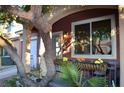 Inviting front porch with colorful flowers and seating at 5402 Cross Meadows Ln, Las Vegas, NV 89122