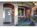 Small front porch with seating and potted plants at 5402 Cross Meadows Ln, Las Vegas, NV 89122