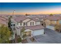 Two-story house with attached garage, and neighborhood view at 6005 Bristol Crest Ln, Las Vegas, NV 89139