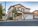 Two-story house with attached garage and desert landscaping at 6005 Bristol Crest Ln, Las Vegas, NV 89139
