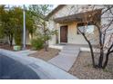 Front entry with stairs, landscaping, and rock pathway at 6005 Bristol Crest Ln, Las Vegas, NV 89139