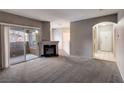 Bright living room with fireplace and access to patio at 9000 Las Vegas Blvd # 2134, Las Vegas, NV 89123