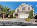 Two-story house with a white garage door and landscaping at 10150 Timber Willow Ave, Las Vegas, NV 89135