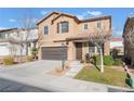 Two-story house with brown accents and a landscaped front yard at 10444 Britton Hill Ave, Las Vegas, NV 89129