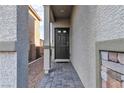 Front entry with a paved walkway leading to the front door at 10931 Cambridge Lakes Ave, Las Vegas, NV 89166