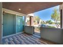 Private patio with brick pavers and gated access at 1254 Venue St # 102, Las Vegas, NV 89135