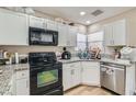 Kitchen features granite countertops and white cabinets at 1324 Jessica Ave, Las Vegas, NV 89104