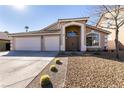 House exterior with a three-car garage and drought-tolerant landscaping at 1781 Lakewood Dr, Henderson, NV 89012