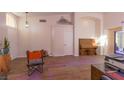 Living room features hardwood floors and a vintage piano at 2044 Glorieta Ln, Las Vegas, NV 89134