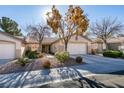 A charming house with a well-manicured front yard at 2091 Poppywood Ave, Henderson, NV 89012