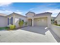 Front courtyard with tiled flooring, and attached garage at 2236 Waterton Rivers Dr, Henderson, NV 89044