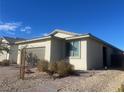 Single story house with brown garage door and neutral color scheme at 2254 Cold Canyon Ave, North Las Vegas, NV 89086