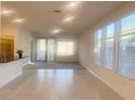 Bright and spacious living room with tile floors and backyard access at 2254 Cold Canyon Ave, North Las Vegas, NV 89086