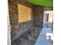 Stone exterior wall with damaged window requiring repair at 3011 Liberty Cir, Las Vegas, NV 89121