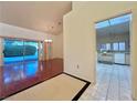 Open dining area with hardwood floors and view of the kitchen at 3012 Morning Ridge Dr, Las Vegas, NV 89134