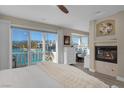 Spacious main bedroom with fireplace and water views at 3173 Lido Isle Ct, Las Vegas, NV 89117