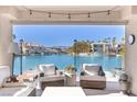 Relaxing patio with waterfront views and comfortable seating at 3173 Lido Isle Ct, Las Vegas, NV 89117