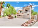 Two-story house with three-car garage and mature trees at 3380 Shallow Pond Dr, Las Vegas, NV 89117