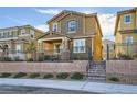 Two-story house with brown exterior, gray shutters, and a small front yard at 3615 Bitonto Ln, Henderson, NV 89044