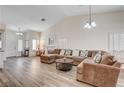 Large living room featuring an L-shaped sectional sofa at 3790 Morning Canyon St, Las Vegas, NV 89147