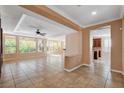 Spacious living room with tile floors and a view to the kitchen at 5026 Vincitor St, Las Vegas, NV 89135