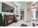 Living room with fireplace, TV, and a view of a bathroom at 5599 Valley Mill St, Las Vegas, NV 89148