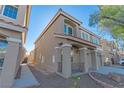 Two story house with gray exterior, walkway, and landscaping at 6607 Musette Ave, Las Vegas, NV 89139