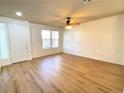 Bright living room with hardwood floors and ceiling fan at 6607 Musette Ave, Las Vegas, NV 89139