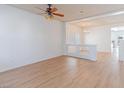 Light and bright living room with light wood floors and ceiling fan at 6607 Musette Ave, Las Vegas, NV 89139