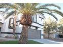 House exterior showcasing landscaping and palm trees at 7409 Flat Rock St, Las Vegas, NV 89131